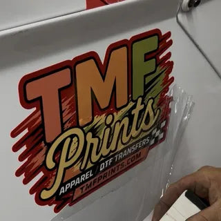 UV DTF car decal being applied to a vehicle — TMFPrints Wichita KS